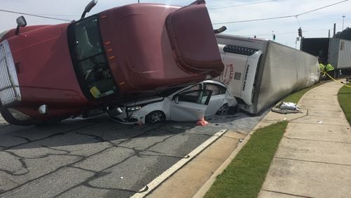 A tractor-trailer nearly crushed this car during a crash in Gwinnett County. (Credit: Channel 2 Action News)