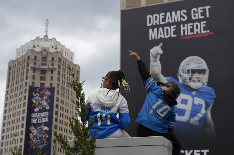 Fans watch during the third day of the NFL football draft, Saturday, April 27, 2024, in Detroit. (AP Photo/Jeff Roberson)