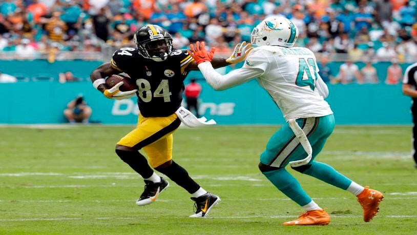 Pittsburgh Steelers wide receiver Antonio Brown (84) runs as Miami Dolphins cornerback Byron Maxwell (41) defends during the second half of an NFL football game, Sunday, Oct. 16, 2016, in Miami Gardens, Fla. (AP Photo/Lynne Sladky)