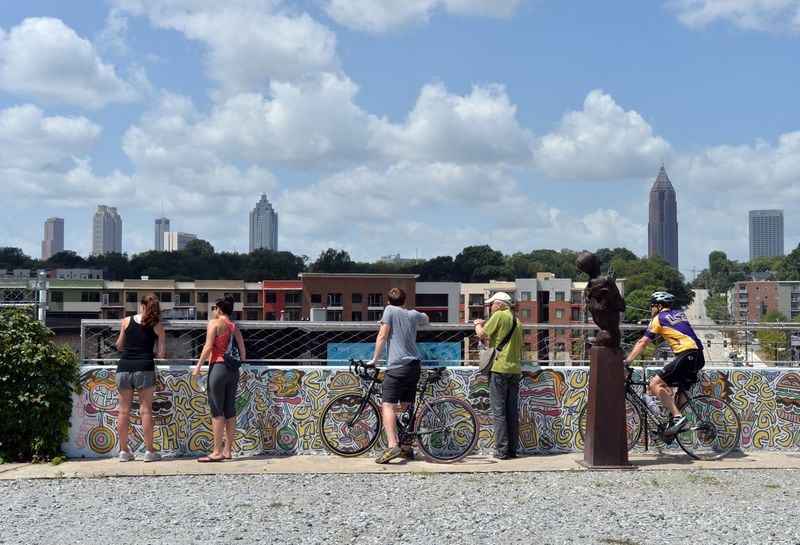August 23, 2014, Atlanta - Runners, walkers and bikers view the skyline from the Atlanta Beltline’s Eastside Trail. HYOSUB SHIN / HSHIN@AJC.COM