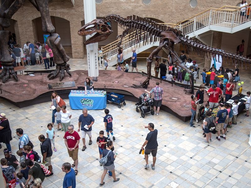 People walk from station to station learning about robots during Robots Day at the Fernbank Museum of Natural History on Saturday, June 23, 2018. (STEVE SCHAEFER / SPECIAL TO THE AJC)