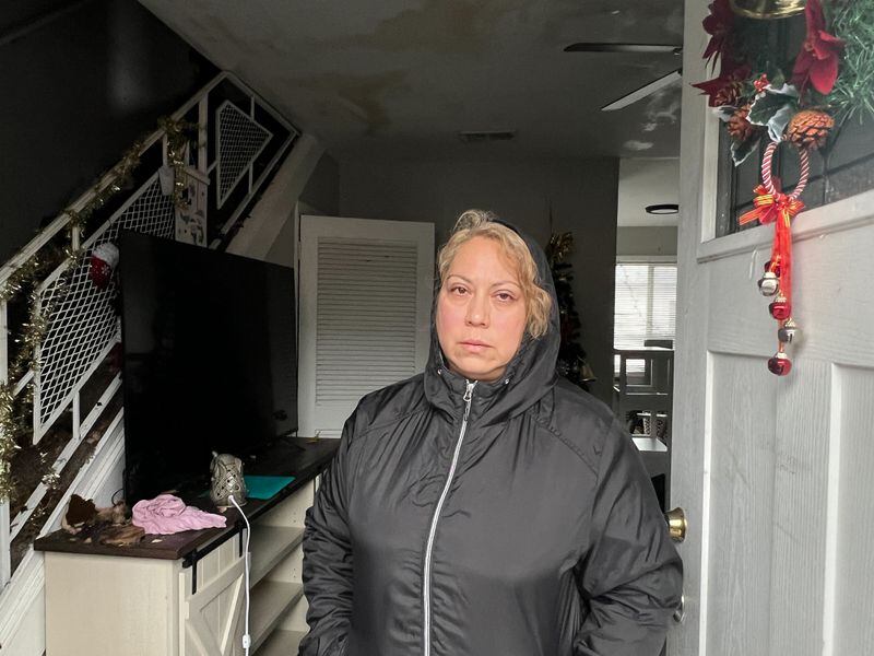 Ofelia Lara stands in her Sandy Springs apartment on Christmas morning 2023. A fire at the building overnight displaced her and more than a dozen other residents on the holiday. (Photo: Cassidy Alexander)