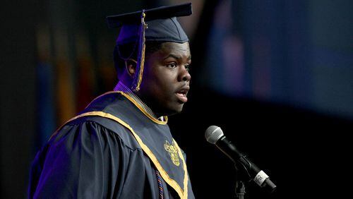 Walter Coggins Jr. speaks at his graduation from Atlanta's Best Academy at the Georgia Dome in May.