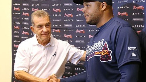 Braves President John Schuerholz and former outfielder Andruw Jones shake hands at the conclusion of a press conference announcing the two will be inducted into the Braves Hall of Fame later this summer.
