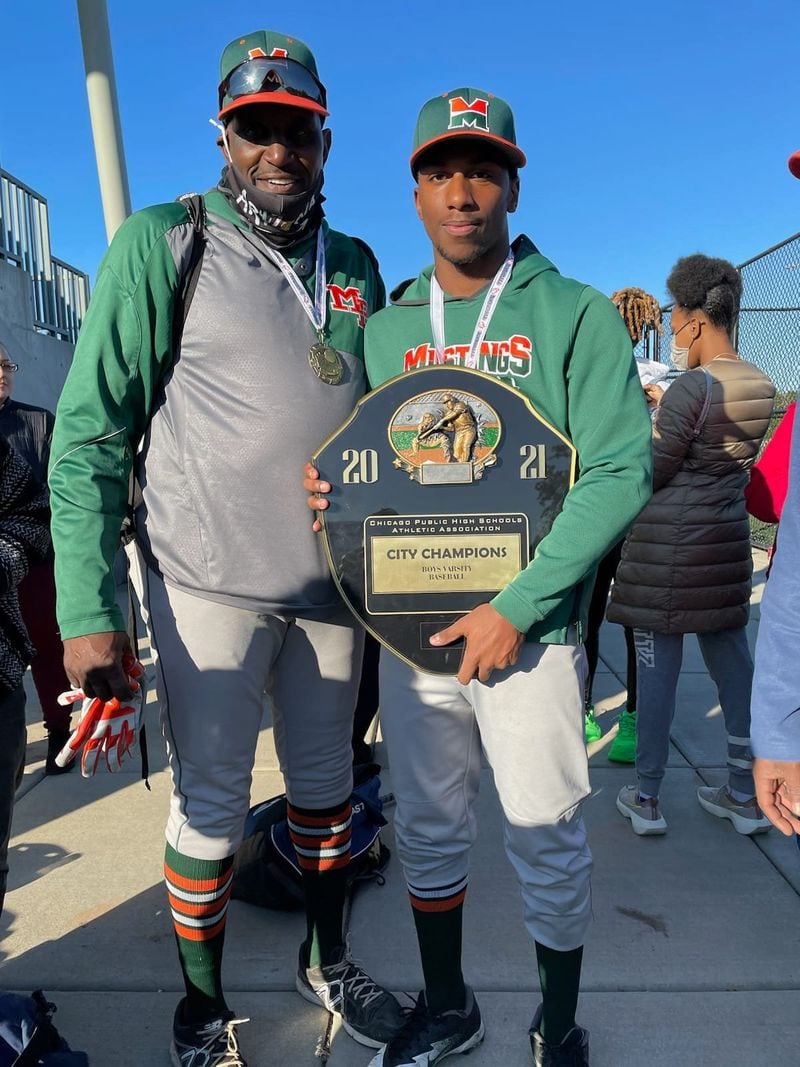 Jatonne Sterling, right, is shown in this photograph with his high school baseball coach, Ernest Radcliffe, after their team won a Chicago city championship in 2021. Photo courtesy of Ernest Radcliffe.