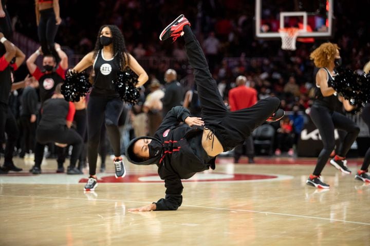 A performer breakdances during a game between the Atlanta Hawks and the Brooklyn Nets at State Farm Arena in Atlanta, GA., on Friday, December 10, 2021. (Photo/ Jenn Finch)