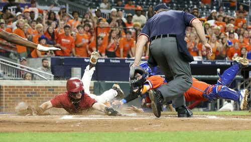 Parkview catcher Ethan Finch, right, tags out Lowndes’ Carson Page, left, at home plate to end the fourth inning in game one of the GHSA baseball 7A state championship at Truist Park, Tuesday, May 16, 2023, in Atlanta. Lowndes won 3-2. (Jason Getz / Jason.Getz@ajc.com)