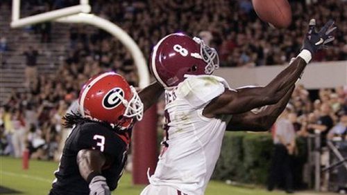 Alabama’s Julio Jones (8) makes a catch for a touchdown as Georgia’s Bryan Evans defends during the second quarter of an NCAA college football game in Athens, Ga., Saturday, Sept. 27, 2008. (AP Photo/John Bazemore)