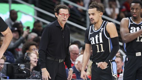 Hawks coach Quin Snyder, left, talks with guard Trae Young (11) during the second half against the San Antonio Spurs in the Hawks’ annual MLK Day game at State Farm Arena, Monday, Jan. 15, 2024. The Atlanta Hawks won 109-99. (Jason Getz / Jason.Getz@ajc.com)