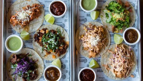 Tacos at Taco Cantina in Old Fourth Ward include (left tray, from top) la tinga de pollo, chorizo cantina and la carne asada; (right tray, from top) pescado frito (fried fish), camaron frito (fried shrimp) and fried chicken. CONTRIBUTED BY HENRI HOLLIS