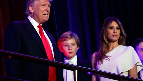 FILE - In this Nov. 9, 2016, file photo, President-elect Donald Trump, left, arrives to speak at an election night rally with his son Barron and wife Melania, in New York. Breaking with tradition, Donald Trump will move into the White House after the inauguration while wife Melania and 10-year-old son Barron plan to remain in New York City until at least the end of the school year. (AP Photo/Evan Vucci, File)