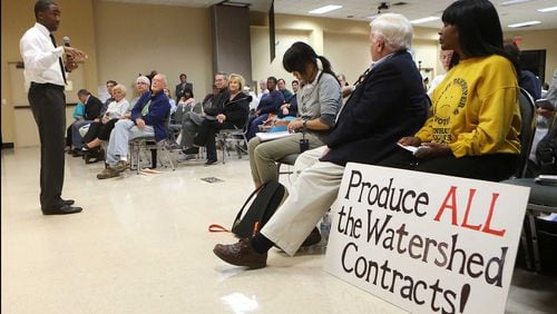 Interim DeKalb County CEO Lee May addressed residents demanding answers about excessively high water bills during a town hall meeting at the Maloof Auditorium in Decatur on Nov. 10. Curtis Compton/ccompton@ajc.com