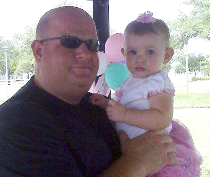 Aaron Feis is pictured with his daughter, Arielle, in an undated family photo. The assistant football coach and security guard at Marjory Stoneman Douglas High School in Parkland, Florida, was gunned down Feb. 14, 2018, as he shielded students from a gunman. Feis was one of 17 people killed in the mass shooting.