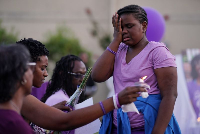 Willow Bell, 10, cries at the candlelight vigil for her sister, Imani Bell Wednesday, Aug. 21, 2019, at Dixon Grove Baptist Church in Jonesboro. The 16-year-old Clayton student died during outdoor athletic drills for Elite Scholars Academy. (Elijah Nouvelage for The Atlanta Journal-Constitution)