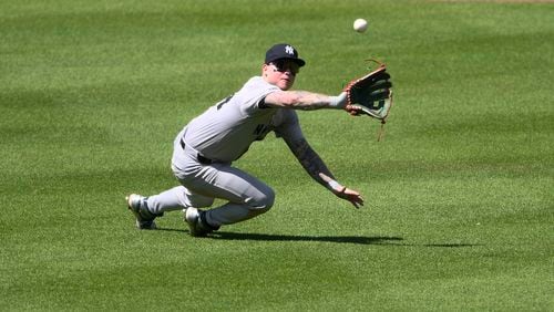 New York Yankees left fielder Alex Verdugo prepares to make a catch on a sacrifice fly by Baltimore Orioles' Jorge Mateo during the fifth inning of a baseball game, Thursday, May 2, 2024, in Baltimore. (AP Photo/Nick Wass)