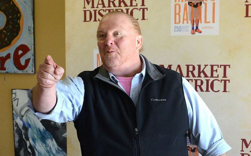 Mario Batali arrived in his signature outfit: a black vest over a shirt with rolled-up sleeves, Bermuda shorts, blue socks and orange Crocs. (Lake Fong/Pittsburgh Post-Gazette/TNS)
