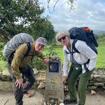 Bill Torpy and wife, Julie, pause at the marker saying they have 100 kilometers to go on the El Camino de Santiago.