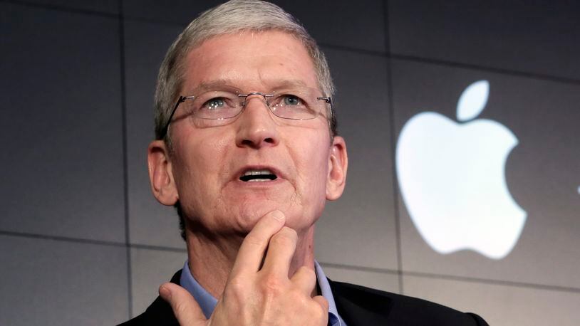 Apple CEO Tim Cook, perhaps wondering how to talk some tax sense into Hillary Clinton and other liberals. (AP file photo)