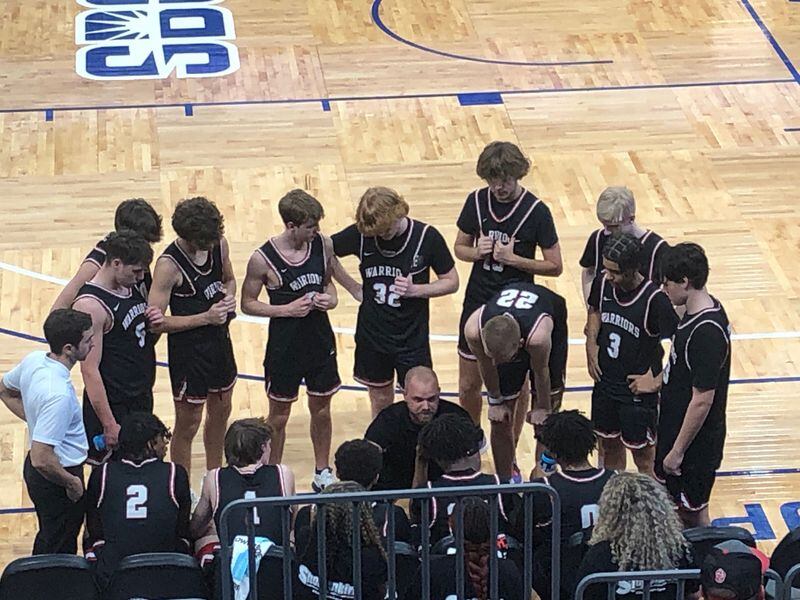 Cherokee coach Joe Veihman draws up a play on the sideline during the 7A semifinal game against Norcross. Cherokee won the game 63-60 in overtime on March 4, 2023, at Georgia State.