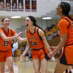 Thrill of victory: North Cobb guard Taylor Albritton (33), forward Kaiya Sibley-Clark (34, center), and forward Sonia Velez (23) celebrate the team's 45-40 win against Mill Creek in the first round of the girls’ Class 7A playoffs at Mill Creek High School, Tuesday, February 20, 2024, in Hoschton, Ga. (Jason Getz / jason.getz@ajc.com)