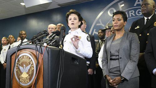 Atlanta Police Chief Erika Shields speaks as Atlanta Mayor Keisha Bottoms, at left, listens during a news conference Thursday to discuss public safety and emergency preparedness for the College Football Playoff National Championship. (John Amis)
