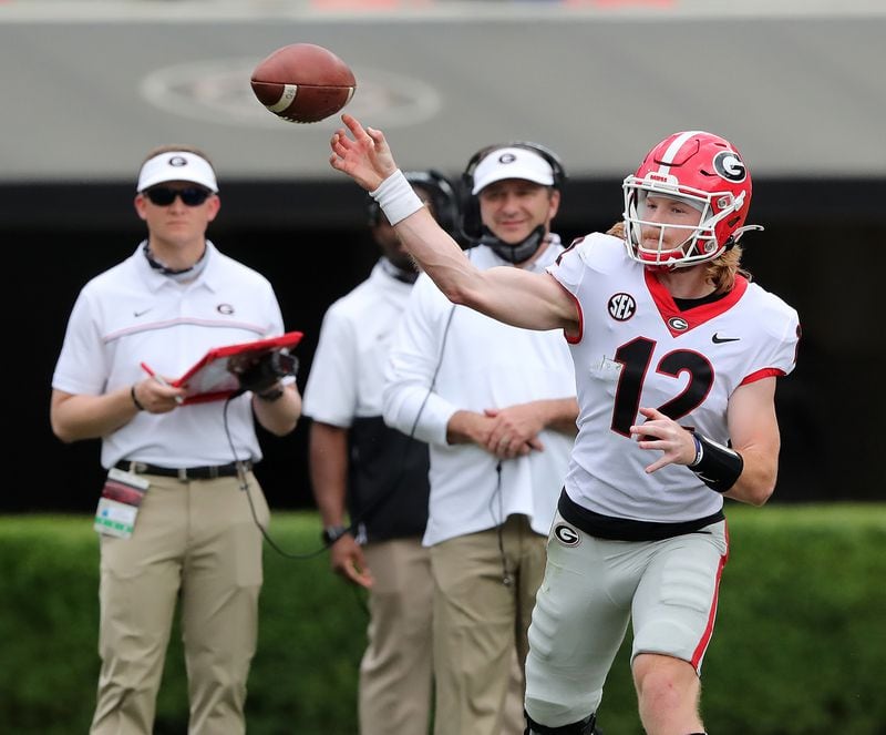 Kirby Smart looks on as quarterback Brock Vandagriff completes a pass during the second half of the G-Day Game at Sanford Stadium on Saturday, April 17, 2021, in Athens.   “Curtis Compton / Curtis.Compton@ajc.com”