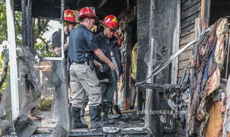 Atlanta fire investigators are still looking into how and when the fire was started at a home on Coleman Street. JOHN SPINK / JSPINK@AJC.COM