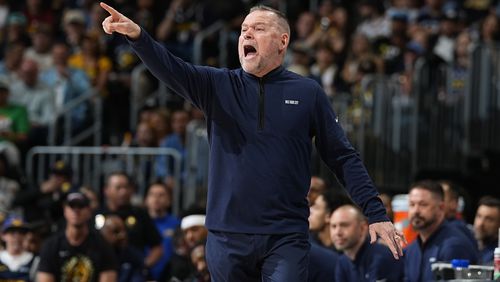 Denver Nuggets head coach Michael Malone directs his team in the first half of an Game 1 of an NBA basketball second-round playoff series against the Minnesota Timberwolves Saturday, May 4, 2024, in Denver. (AP Photo/David Zalubowski)