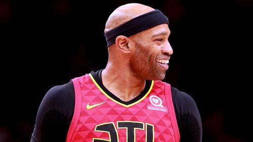 Atlanta Hawks Vince Carter is all smiles after scoring against the Milwaukee Bucks in a NBA basketball game on Sunday, March 31, 2019, in Atlanta.    Curtis Compton/ccompton@ajc.com