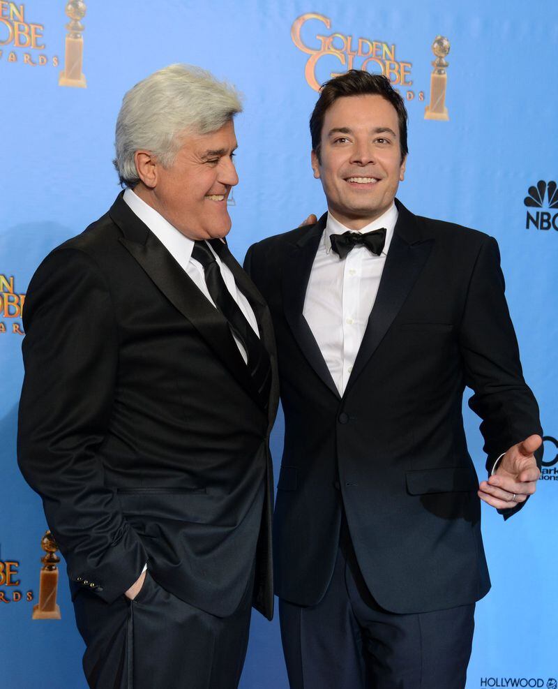 File- This Jan. 13, 2013, file photo shows presenters Jimmy Fallon, left, and Jay Leno posing backstage at the 70th Annual Golden Globe Awards at the Beverly Hilton Hotel in Beverly Hills, Calif. (Photo by Jordan Strauss/Invision/AP)