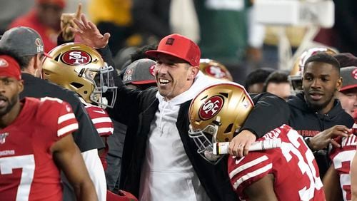 San Francisco 49ers head coach Kyle Shanahan (center) celebrates with players during the NFC Championship game against the Green Bay Packers Sunday, Jan. 19, 2020, in Santa Clara, Calif. The 49ers won 37-20 to advance to Super Bowl 54 against the Kansas City Chiefs.