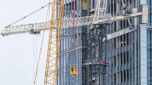 Residents were allowed to return home Friday after being evacuated from West Peachtree Street last week when a crane malfunctioned and became unstable.