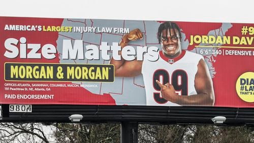 March 9, 2022 Atlanta: UGA defensive tackle, Jordan Davis appears on this southbound I-75/I-85 legal firm’s billboard near University Avenue in Atlanta, Georgia on Wednesday, March 9, 2022. (John Spink / John.Spink@ajc.com)
