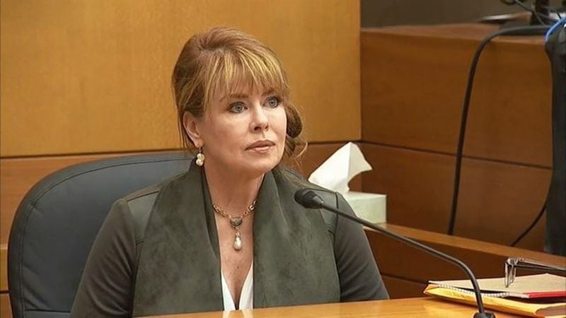 Dani Jo Carter, a friend of the McIvers, testifies at the murder trial of Tex McIver on March 19, 2018 at the Fulton County Courthouse. She has been named in a wrongful death lawsuit filed by Diane McIver’s estate.