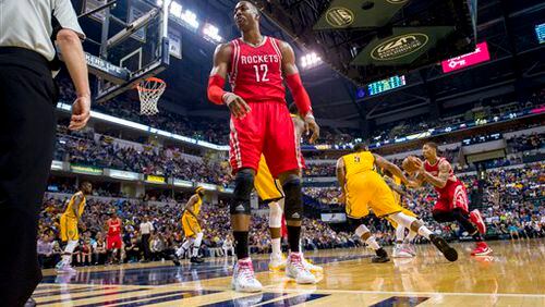 Houston Rockets center Dwight Howard (12) turns to complain toward an official after believing he had been fouled during an NBA basketball game against the Indiana Pacers, Sunday, March 27, 2016, in Indianapolis. The Pacers won 104-101. (AP Photo/Doug McSchooler)