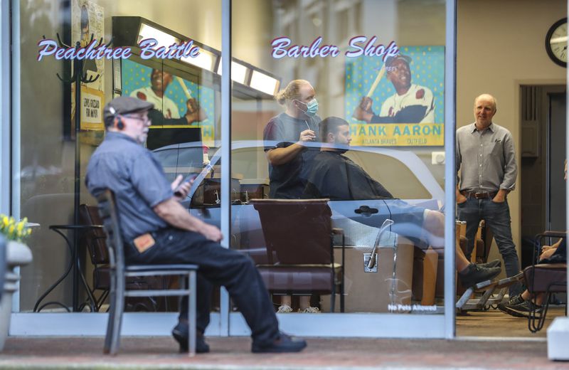 Peachtree Battle Barber Shop in Atlanta on Friday, April 24, 2020, when the first phase of Gov. Brian Kemp’s plan to reopen some Georgia businesses during the coronavirus pandemic went into effect. JOHN SPINK/JSPINK@AJC.COM