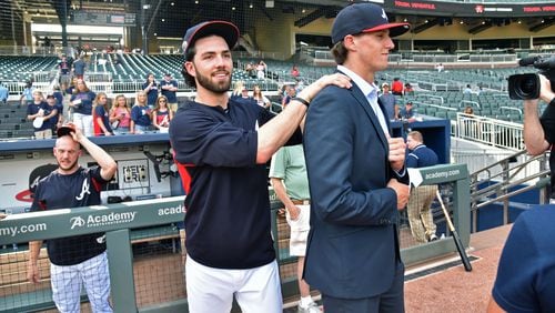 Kyle Wright (right) got a warm welcome from his former Vanderbilt teammate Dansby Swanson after Wright was selected by the Braves in the first round of the June draft HYOSUB SHIN / HSHIN@AJC.COM