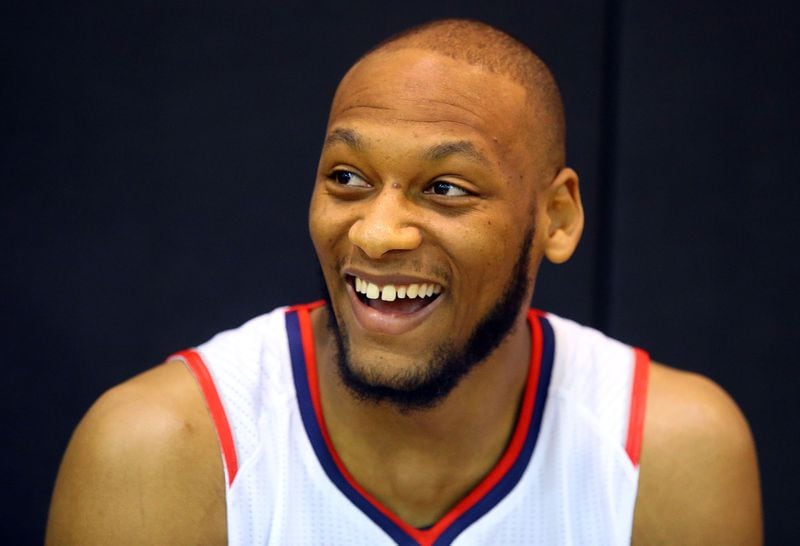092914 ATLANTA: Hawks forward/center Adreian Payne breaks into laughter during an interview on Media Day at Philips Arena on Monday, Sept. 29, 2014, in Atlanta. CURTIS COMPTON / CCOMPTON@AJC.COM Rookie Adreian Payne scored four points in his exhibition debut.