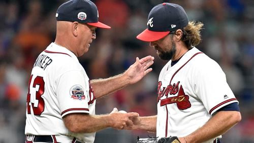 ATLANTA, GA - SEPTEMBER 4: R. A. Dickey #19 of the Atlanta Braves is removed from the game by Manager Brian Snitker #43 during the fifth inning against the Texas Rangers at SunTrust Park on September 4, 2017 in Atlanta, Georgia. (Photo by Scott Cunningham/Getty Images)