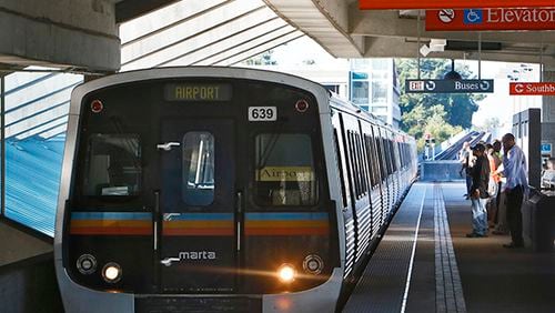 A columnist writes that MARTA could invest more money in service by raising fares, particularly to the airport. Here a train pulls into Doraville station.