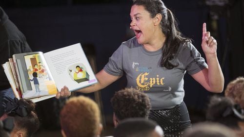 Atlanta Public Schools Superintendent Meria Carstarphen reads to students as she closes out her final State of the District address at the newly renovated Harper-Archer Elementary School. AJC file photo BOB ANDRES / ROBERT.ANDRES@AJC.COM