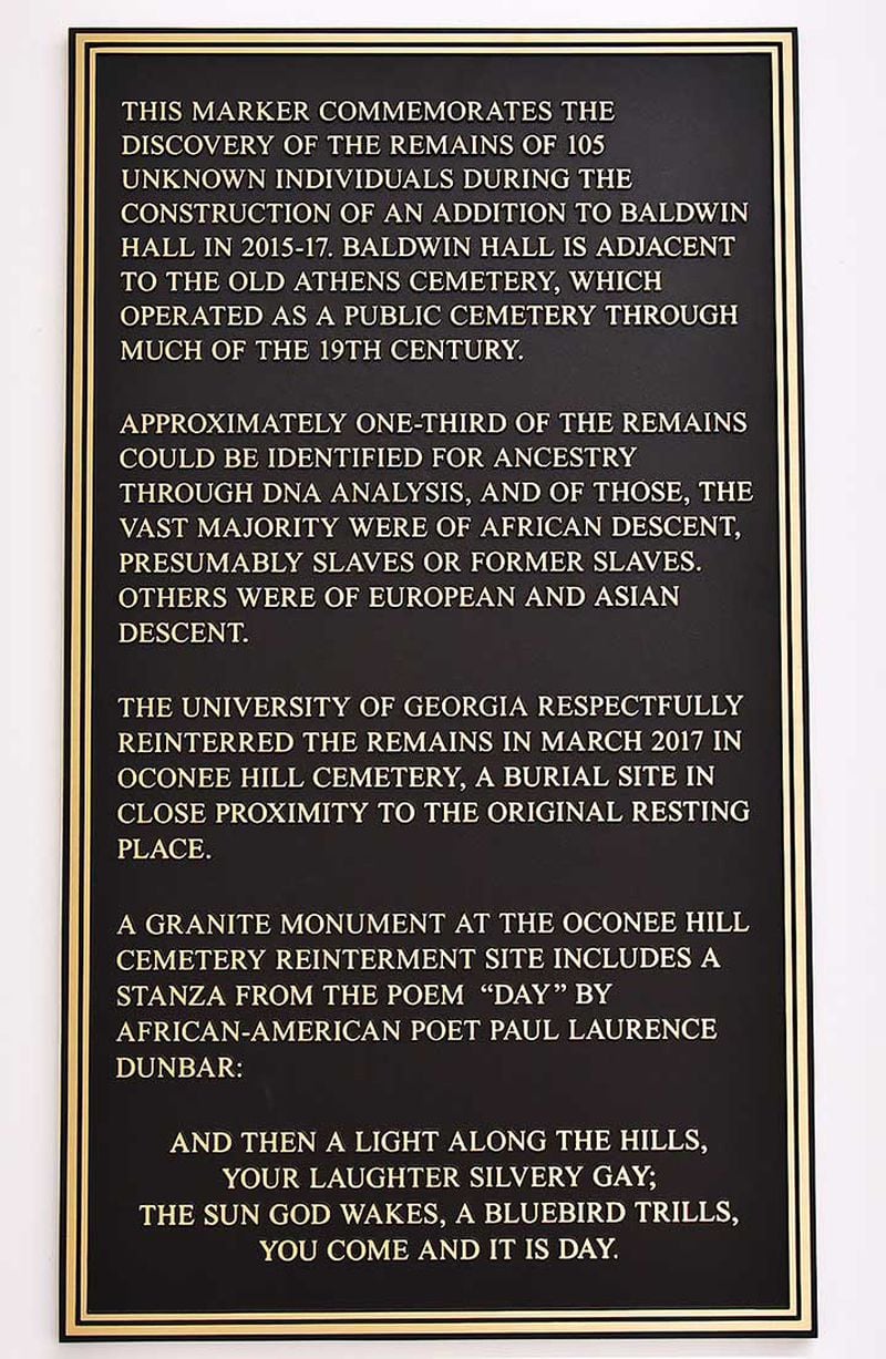 A plaque is displayed inside Baldwin Hall near Old Athens Cemetery on University of Georgia campus in Athens.