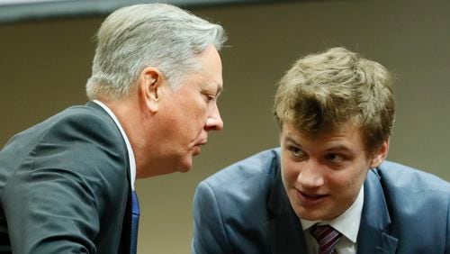 September 27, 2019 - Decatur - Robert Olsen confers with  Lukas Alfen, one of his attorneys, between witnesses this morning. The murder trial of former DeKalb County Police Officer Robert "Chip" Olsen continued with testimony from prosecution witnesses this morning.  Olsen is charged with murdering war veteran Anthony Hill.  Bob Andres / robert.andres@ajc.com