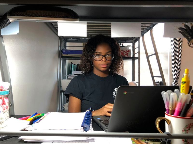 Cydney Suber, a senior at Norristown Area High School, does schoolwork at her home in Norristown, Pa. Michael Rubinkam/ AP Photo