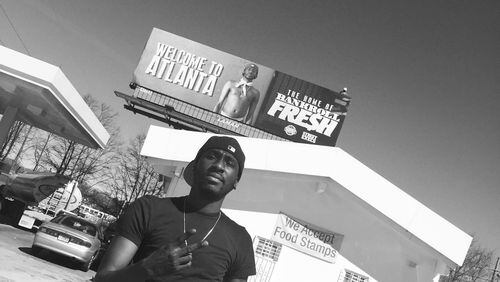 Bankroll Fresh poses with his billboard in Atlanta last year.