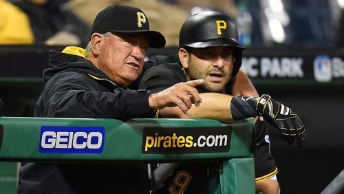 Manager Clint Hurdle talks with Francisco Cervelli of the Pittsburgh Pirates during the seventh inning against the Chicago Cubs on May 3, 2016 at PNC Park in Pittsburgh, Pennsylvania. (Photo by Joe Sargent/Getty Images)