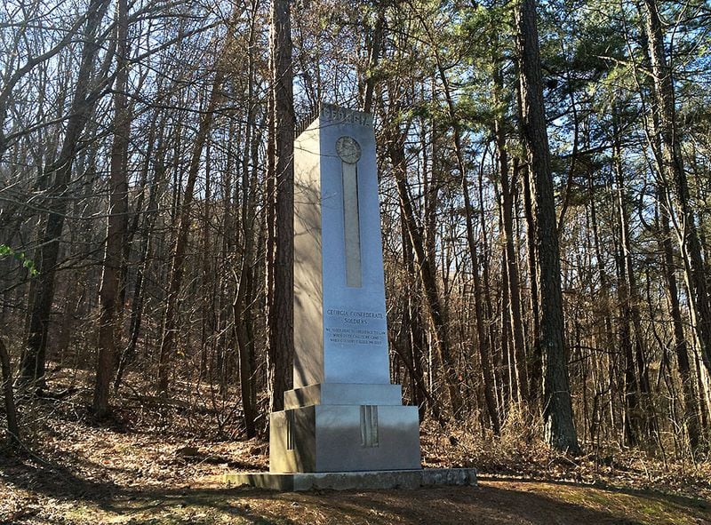A lesser-known Kennesaw Mountain National Battlefield Park memorial near the park's visitors center and commemorates Georgia's Confederate soldiers. The carving on its front says, "We sleep here in obedience to law / When duty called, we came / When country called we died." (Pete Corson/AJC)