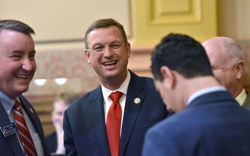 U.S. Rep. Doug Collins, shown speaking with state legislators, spent three terms in the Georgia House, where he became a floor leader for Gov. Nathan Deal. His efforts there included shepherding a controversial revision of the Hope scholarship through the Legislature. HYOSUB SHIN / HSHIN@AJC.COM