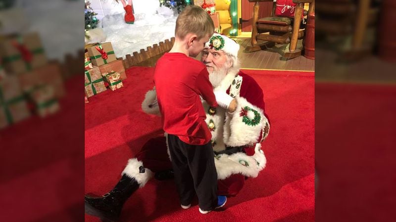 Matthew, 6, who is blind and has autism met Santa recently. The photos of the encounter are going viral.