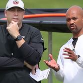 Falcons coach Arthur Smith (left) and general manager Terry Fontenot (right) confer during team practice at minicamp Wednesday, Jun 10, 2021, in Flowery Branch. (AJC file)